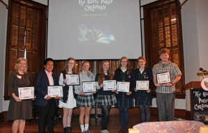 Winners of the high school essay scholarships pose after the event.