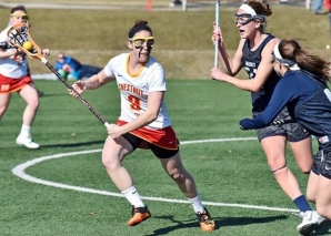 Captain Emorie Keimig '16 cradles the ball during the season opener against West Chester