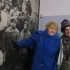 Eva Kor, standing with Marie Conn, Ph.D., points to a picture of herself as a young girl in Auschwitz.